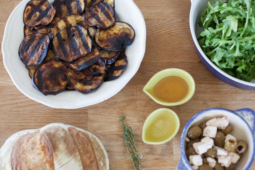 GRILLED EGGPLANT TARTINES WITH ARUGULA, FETA, GREEN OLIVES AND HONEY