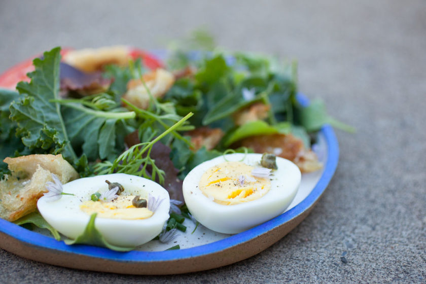 SALAD WITH HARD BOILED EGGS, GARLIC CROUTONS, FRIED CAPERS, AND BREADCRUMB DRESSING