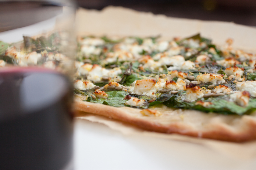 GARLIC SPINACH FLATBREAD WITH FETA, LEMON ZEST, AND SUNFLOWER SEEDS