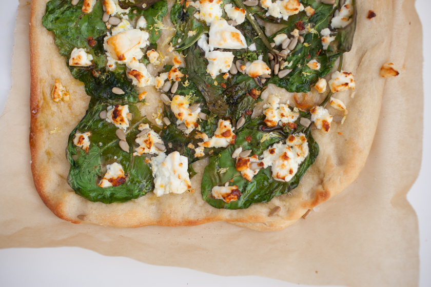 GARLIC SPINACH FLATBREAD WITH FETA, LEMON ZEST, AND SUNFLOWER SEEDS
