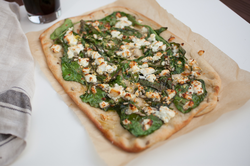 GARLIC SPINACH FLATBREAD WITH FETA, LEMON ZEST, AND SUNFLOWER SEEDS